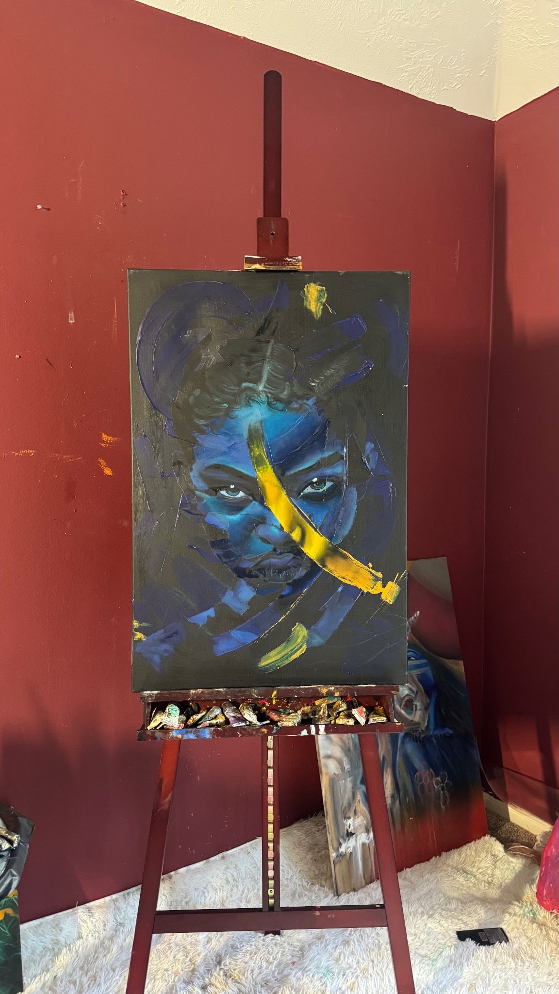 Blue Rupture original painting displayed on the artist's easel